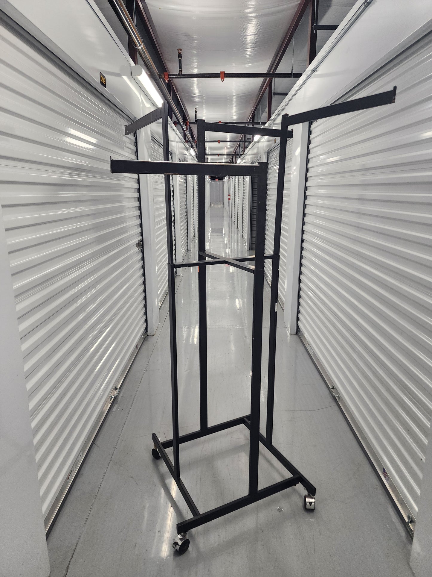 Multi-arm Clothing rack retail display Black Metal with wheels