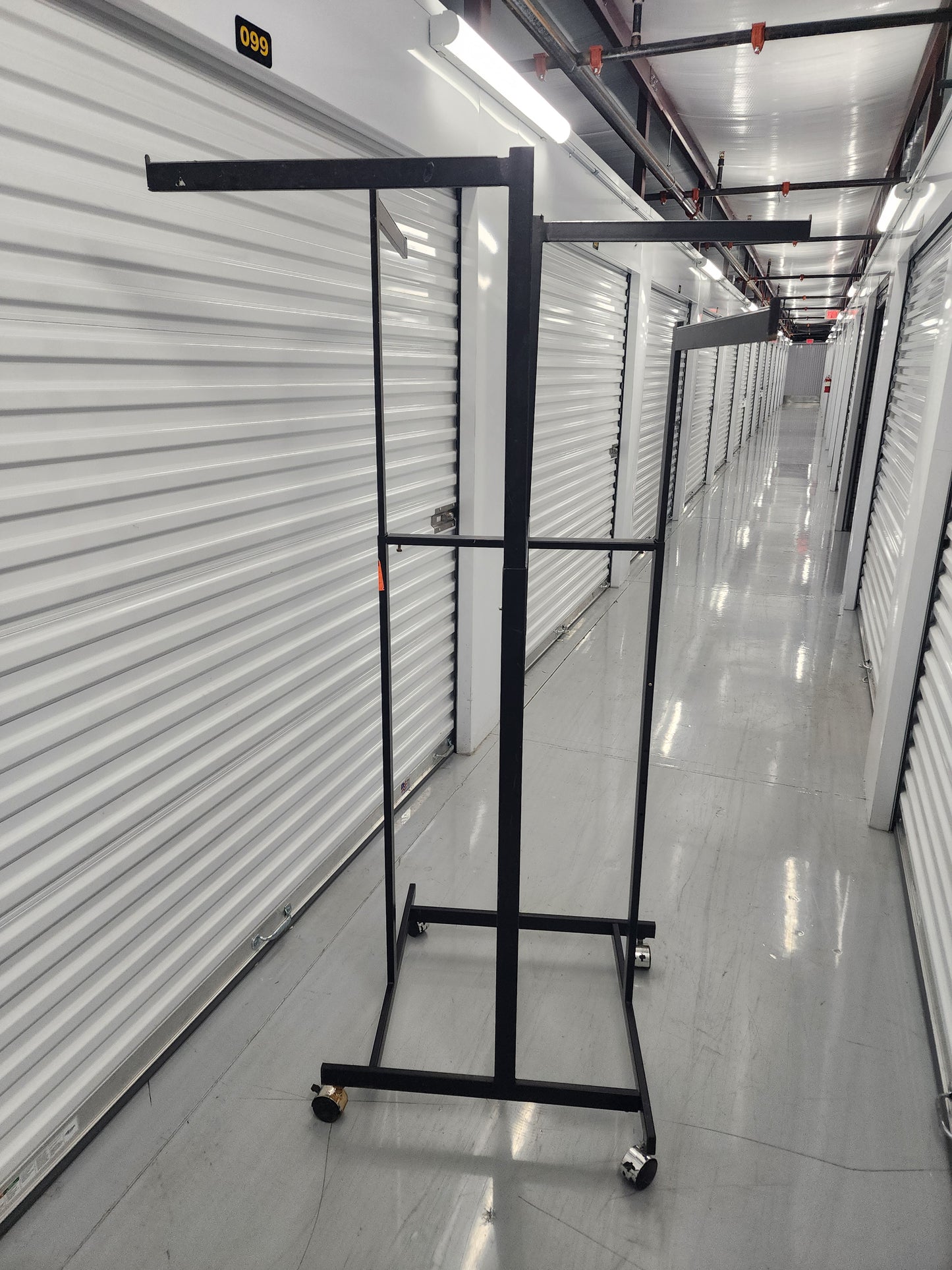 Multi-arm Clothing rack retail display Black Metal with wheels