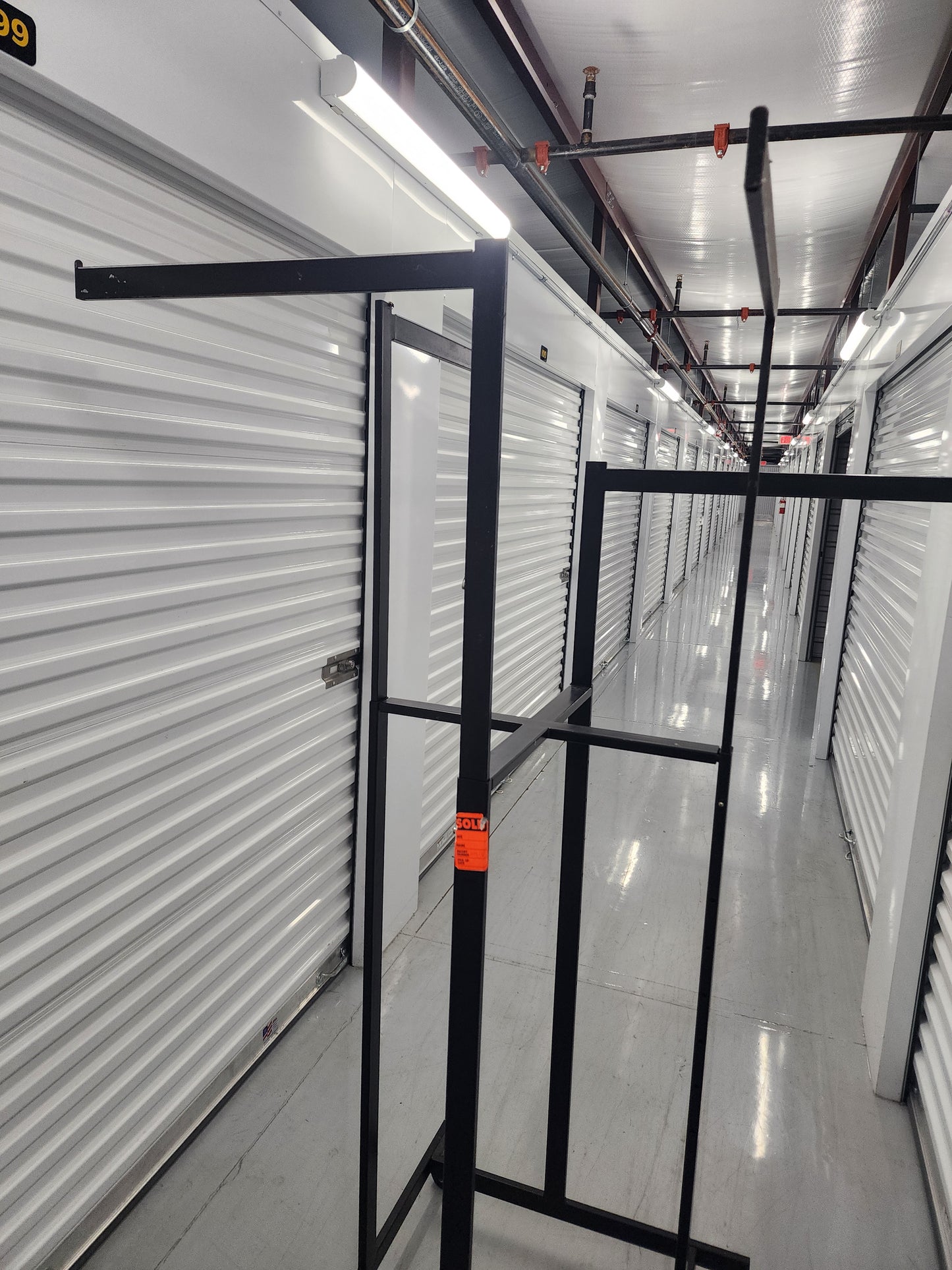 Multi-arm Clothing rack retail display Black Metal with wheels