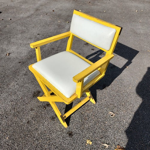 Vintage yellow campaign style chair