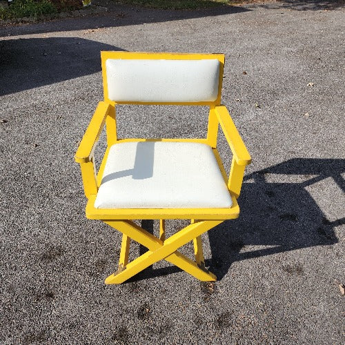 Vintage yellow campaign style chair