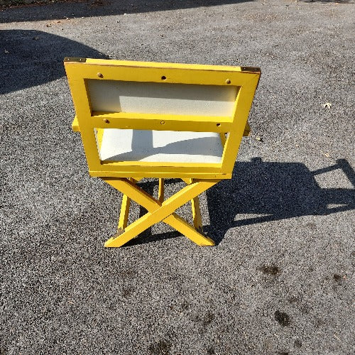 Vintage yellow campaign style chair