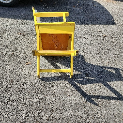 Vintage yellow campaign style chair