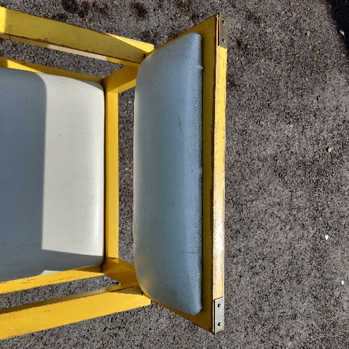 Vintage yellow campaign style chair