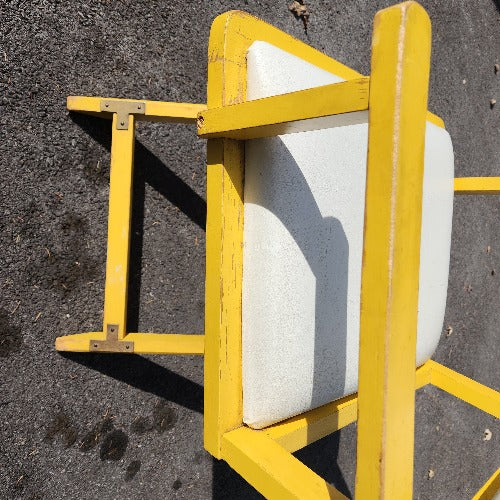 Vintage yellow campaign style chair